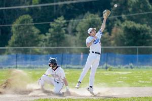 Sequims Zeke Schmadeke successfully steals second before the ball gets to Rivals second baseman Rylan Dunn during a game played in Chimacum on Tuesday. (Steve Mullensky/for Peninsula Daily News)