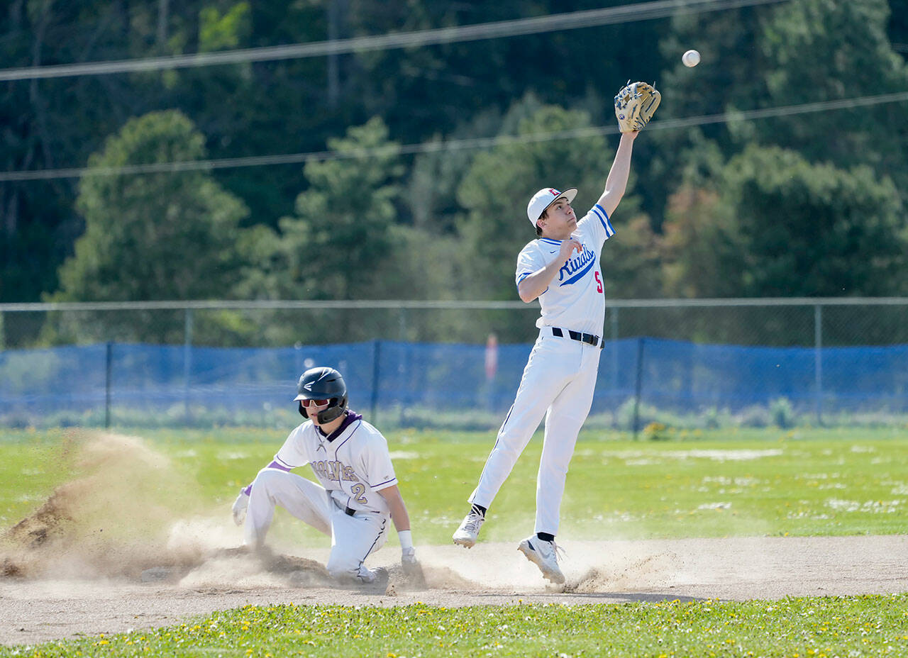 Sequims Zeke Schmadeke successfully steals second before the ball gets to Rivals second baseman Rylan Dunn during a game played in Chimacum on Tuesday. (Steve Mullensky/for Peninsula Daily News)