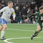 KEITH THORPE/PENINSULA DAILY NEWS
Port Angeles' Keane McClain, right, chases a loose ball as Bremerton's Brennan Galloway closes in on Thursday night in Port Angeles.