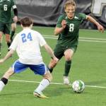 KEITH THORPE/PENINSULA DAILY NEWS Port Angeles Jacob Miller, right, pushes for the ball as Bremertons Colton Hawk looks for an opening on Thursday night in Port Angeles.