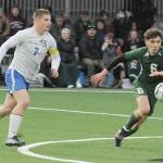 KEITH THORPE/PENINSULA DAILY NEWS Port Angeles Keane McClain, right, chases a loose ball as Bremertons Brennan Galloway closes in on Thursday night in Port Angeles.