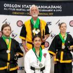 These members of the White Crane Martial Arts school in Port Angeles won medals at the Northwest Regional Hanmadang Championships in Eugene, Ore., this past weekend. Top center is school Grandmaster Robert Nicholls; left is Zach Irving, right is Connie Irving and bottom center is Annabelle Norcross from White Crane affiliate school Cross Martial Arts in Poulsbo. (Courtesy photo)