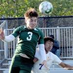 KEITH THORPE/PENINSULA DAILY NEWS
Port Angeles' Landon Close, left, goes up and over Highline's Yonatan Garcia-Arevalo on Tuesday in Port Angeles.