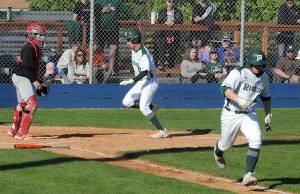 Photos by KEITH THORPE/PENINSULA DAILY NEWS
Port Angeles Colton Romero, center, reaches the plate thanks to a sacrifice bunt by teammate Jordan Shumway, right, as Franklin Pierce catcher Trey Smith looks on helplessly in the second inning of Wednesdays playoff game at Port Angeles Civic Field.