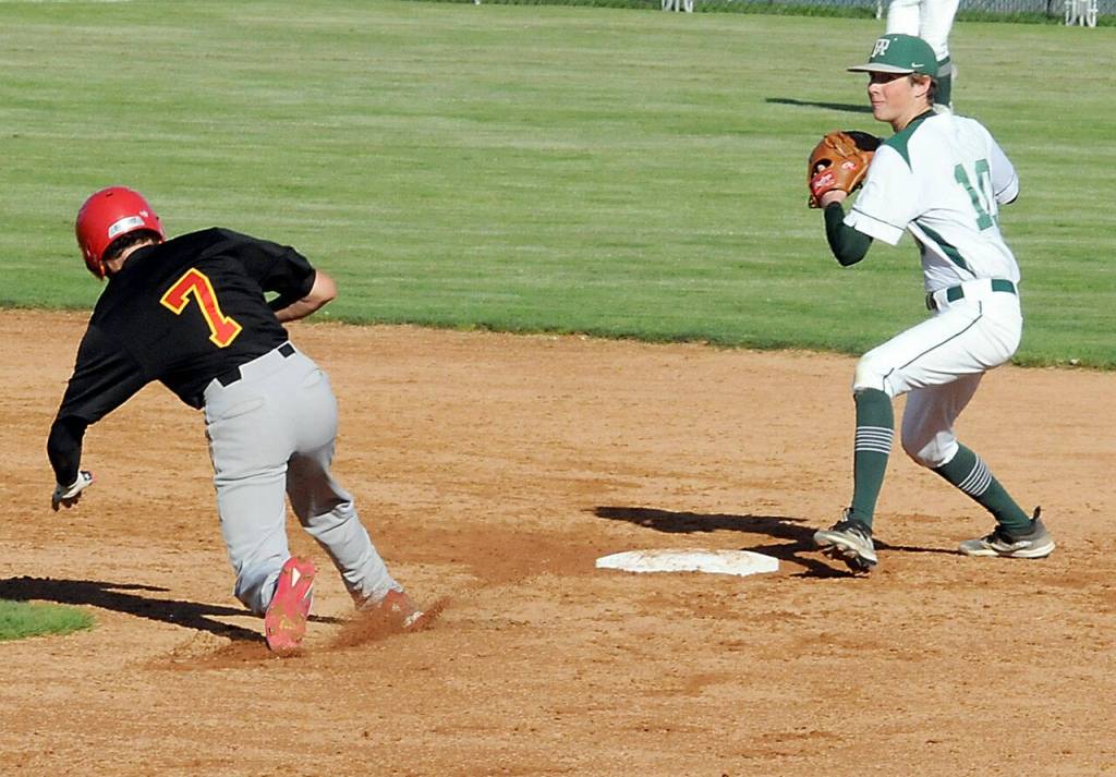KEITH THORPE/PENINSULA DAILY NEWS Port Angeles second baseman Kole Acker makes the force out on Franklin Pierce baserunner Elijah Sledge in the fourth inning on Wednesday in Port Angeles.