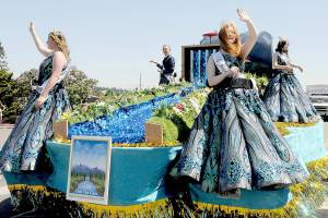 Sequim Irrigation Festival royalty, from left, Princess Paige Skylar Krzyworz, Prince Fred Cameron, Princess Anne Marie Barni and Queen Pepper Reymond preside over the festival from their float in Saturdays Grand Parade. (Keith Thorpe/Peninsula Daily News)