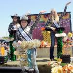Clallam County Fair royalty, from left, Princess Olivia Ostlund, Queen Allison Pettit and Junior Princess Kendall Adolphe ride their festival float, which received the Irrigation Festival Chairmans Award. (Keith Thorpe/Peninsula Daily News)