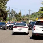 Law enforcement agencies respond Tuesday afternoon to a standoff at Lopez Avenue and Vine Street in Port Angeles. (Dave Logan/for Peninsula Daily News)
