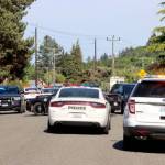 Law enforcement agencies respond Tuesday afternoon to a standoff at Lopez Avenue and Vine Street in Port Angeles. (Dave Logan/for Peninsula Daily News)