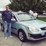 Owner Michael Rocha with a previous years prize vehicle given away by Rocha Family Auto Sales.