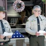 Clallam County Sheriff Brian King, right, speaks about the service of law enforcement personnel as Sgt. (Ret.) Randy Pieper listens in during Fridays bell-ringing ceremony on National Peace Officer Memorial Day at Veterans Park in Port Angeles. (KEITH THORPE/PENINSULA DAILY NEWS)