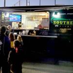 Caleb Messinger and staff with the Southern Nibble food truck serve customers at a Sequim High School soccer game in September 2022. (Michael Dashiell/Olympic Peninsula News Group)