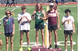Port Angeles' Jack Gladfelter celebrates winning the 1,600 District 2/3 championship this weekend at Renton Stadium. He also won the 3,200 championship. (Joe Gladfelter photo)