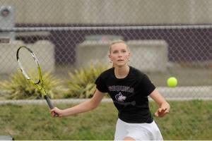 Sequim's Kendall Hastings plays against an Olympic opponent on April 21 in Sequim. Hastings won three matches at the West Central 2/3 2A tournament this weekend and finished second in the district, moving on to the state tennis championships this weekend at the Nordstrom Tennis Center in Seattle. (Michael Dashiell/Olympic Peninsula News Group)
