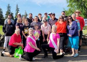 Caldwell, DeLeo and Beebe family members pose with Rhody Festival royalty at the Port Townsend Public Golf Course this weekend. Back row, from left are Chad Caldwell, Ron Wiley, Jim Beebe, Justice Beebe, Joey Beebe, Kelvin Kisner, Carlene Dahlman, Matt Dalman and Paul Dahlman. Middle row, from left are Leslie Shore, Danielle Babb, Karen Cartmel, Michael Babb, Tim Babb, James Babb, Pat Caldwell, Beth Caldwell (partial view), Tim Caldwell, Courtney Caldwell and Rebecca Beebe. Kneeling front, from left is  Jim Caldwell Memorial Rhody Festival Golf tournament organizer Rita Beebe, Rhody Princess Paige Govia and Queen Melody Douglas.