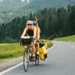 Paula and Anya Eber cycle over the Alps. The Eber family, who were featured in a Travelers Journal in March, will detail their 14,931-kilometer, around-the-world fundraiser adventure on tandem bicycles at the Northwest Tandem Rally on Sunday in Sequim. (Eber family)