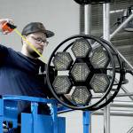 KEITH THORPE/PENINSULA DAILY NEWS
Levi Plumb of Seattle-based R90 Lighting adjusts a stage light on the Main Stage on Thursday in Vern Burton Community Center for this weekend's Juan de Fuca Festival of the Arts.
