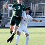 Port Angeles Landon Close, left, goes up and over Highlines Yonatan Garcia-Arevalo on Tuesday in Port Angeles. (Keith Thorpe/Peninsula Daily News)