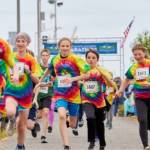 Kids take off during the annual kids marathon held at the Port Angeles City Pier in 2022. The kids marathon returns at 3 p.m. Saturday. (Cascadia Films)