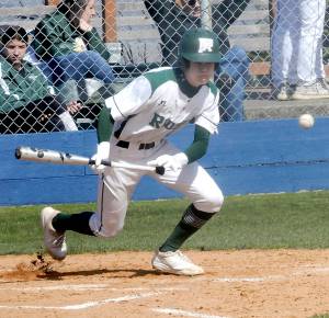 Port Angeles Alex Angevine bunts to advance the baserunners in the second inning against South Whidbey on Tuesday at Port Angeles Civic Field.