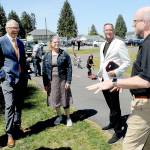Port Angeles Dream Playground Foundation President Steve Methner, right, describes the volunteer effort that went into playground construction to, from left, State Rep. Steve Tharinger, Gov. Jay Inslee, Port Angeles Pump Track designer Catharine Copass and Port Angeles Parks Department director Cori Delikat during a gubenatorial visit to Erickson Playfield on Friday. (KEITH THORPE/PENINSULA DAILY NEWS)