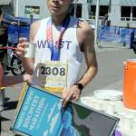 Kaeden Peterson of Kingston, the winner of Saturdays North Olympic Discovery Marathon 10k run, sips water at the end of his race. (Keith Thorpe/Peninsula Daily News)
Kaeden Peterson of Kingston, the winner of Saturdays North Olympic Discovery Marathon 10k run, sips water at the end of his race. (Keith Thorpe/Peninsula Daily News)