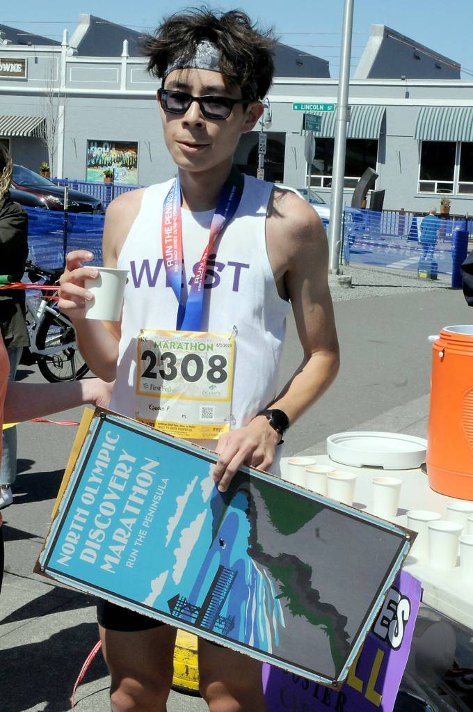 Kaeden Peterson of Kingston, the winner of Saturdays North Olympic Discovery Marathon 10k run, sips water at the end of his race. (Keith Thorpe/Peninsula Daily News)
Kaeden Peterson of Kingston, the winner of Saturdays North Olympic Discovery Marathon 10k run, sips water at the end of his race. (Keith Thorpe/Peninsula Daily News)