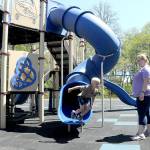 KEITH THORPE/PENINSULA DAILY NEWS
Four-year-old Collin Windrich bolts from a slide on the playground at Shane Park in Port Angeles as his mother, Lissa Windrich of Sequim, watches on Tuesday. The playground equipment was reopened on Monday after being closed by the Port Angeles Parks Department in September 2022 after numerous tiles on the play surface became dislodged, creating a trip hazard for playground users. Delays ensued acquiring specialized glue and replacement tiles while waiting for adequate weather to complete the project.