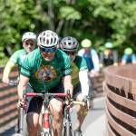 Gov. Jay Inslee rides across the Johnson Creek Railroad Trestle Foot Bridge on the Olympic Discovery Trail east of Sequim on Wednesday. The Rails-to-Trails Conservancy honored Inslee as its 2023 Rail-Trail champion during an event at Red Cedar Hall in Blyn following Inslee's 27-mile ride from Port Angeles. (Jesse Major/Rails-to-Trails Conservancy)