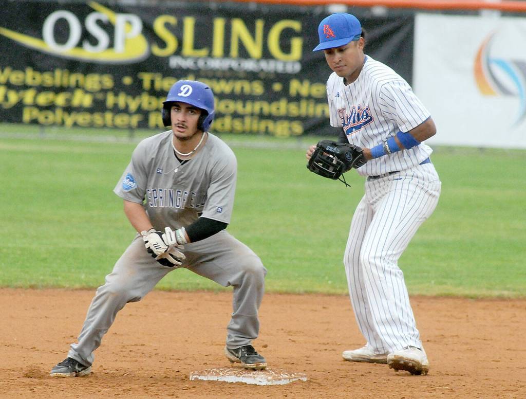 KEITH THORPE/PENINSULA DAILY NEWS Lefties second baseman Roberto Nunez, right, looks for an opportunity to tag out Springfields Dawson Santana at second on Friday night in Port Angeles.