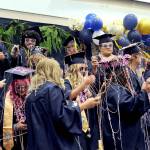 The Forks High School Class of 2023 begins to celebrate at the conclusion of the Commencement Ceremony Saturday afternoon in the Spartan Gym. (Lonnie Archibald/for Peninsula Daily News)