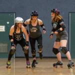 Emily Matthiessen / Olympic Peninsula News Group
From left, Amber Ahrens, Shauna Rogers McClain and Brittney Vincent practice blocker and jammer moves at a recent roller derby practice.
