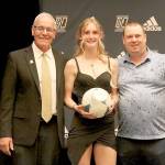 From left, Peninsula College Associate Dean for Athletics and Student Life Rick Ross, Peninsula College soccer and basketball player Millie Long and Baden NW Regional Manager Brandon Williams at the NWAC awards banquet in Pasco on Tuesday. (Duncan Stevenson photo)