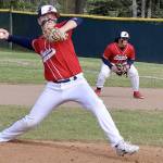 Brandt Perry pitches for Local 155 in the Olympic Junior Babe Ruth championship game against Athletes Choice on Thursday night at Volunteer Field. Playing first base is Chris Jaynes. It was a pitchers' duel as the game went into extra innings. Local 155 ended up winning 3-2 on a walk-off, finishing the season 13-1. (Dave Logan/for Peninsula Daily News)