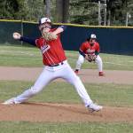 Brandt Perry pitches for Local 155 in the Olympic Junior Babe Ruth championship game against Athletes Choice on Thursday night at Volunteer Field. Playing first base is Chris Jaynes. It was a pitchers duel as the game went into extra innings. Local 155 ended up winning 3-2 on a walk-off, finishing the season 13-1. (Dave Logan/for Peninsula Daily News)