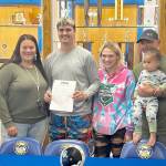From left, mother Alicia Ferro-May, Conner Ferro-May, sister Chloe Ferro-May and stepfather Rich Albaugh celebrate Crescent senior Conner Ferro-May signing a letter of intent to participate in track and field at Mount Hood Community College in Gresham, Ore. (Crescent High School)