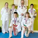 The Sequim Bodystrong Taekwondo Academy adult color class belts competed recently at the 2023 Pacific Northwest Taekwondo tournament in La Center. From left, back row, are Jenifer Williams, Carter Fenner, Christian Fenner and junior grand champion award winner Annabelle Vadnais. Front row, from left, are Anderson Williams and Alysa Lami. (Courtesy photo)