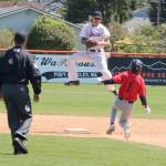 Port Angeles Lefties second baseman Roberto Nunez jumps to catch a throw but isnt able to punch out Kelowna baserunner Eddie Fines on Sunday at Civic Field. (Dave Logan/for Peninsula Daily News)