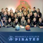 Millie Long, center, signs to play soccer and basketball at Cal Poly, Humboldt surrounded by her Peninsula College teammates. (Peninsula College)