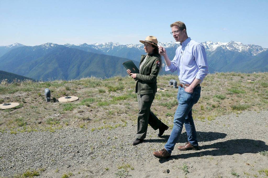 U.S. Rep. Derek Kilmer, D-Gig Harbor, right, walks with Olympic National Park Superintendent Sula Jacobs at Hurricane Ridge after the ridge was reopened to visitors on Tuesday. (Keith Thorpe/Peninsula Daily News)