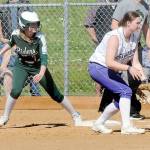 KEITH THORPE/PENINSULA DAILY NEWS Port Angeles Natalie Robinson, left, watches the pitch as Sequim first baseman Sammie Bacon keeps tabs during a May game in Port Angeles.