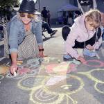 KEITH THORPE/PENINSULA DAILY NEWS
Melissa Preit of Port Angeles and her daughter, Avanelle Priet, 11, make chalk drawings on the sidewalk to the music of The Spin-Offs during Wednesday's season-opening Concert on the Pier music series at Port Angeles City Pier.