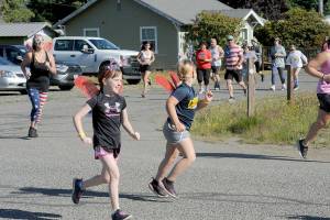 Runners are off and running at the annual Forks 4th of July Fun Run. About 100 participated. (Lonnie Archibald/for Peninsula Daily News)