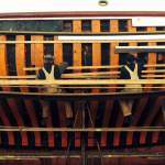 Crew at Haven Boatworks working on the side of a ships hull. Photo courtesy First Fed