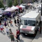 A street fair offering food and crafts takes up the transit bus lane of The Gateway in downtown Port Angeles on Tuesday. (Keith Thorpe/Peninsula Daily News)