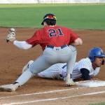 Dave Logan/for Peninsula Daily News
Port Angeles' Roberto Nunez III slides safely back to first base as Wenatchee's Easton Amundson is a tad late with the tag on the throw from the pitcher.