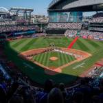 The All-Star Game logo is seen on the field at T-Mobile Park during the national anthem before the baseball game in Seattle, Tuesday, July 11, 2023. (AP Photo/Ted S. Warren)