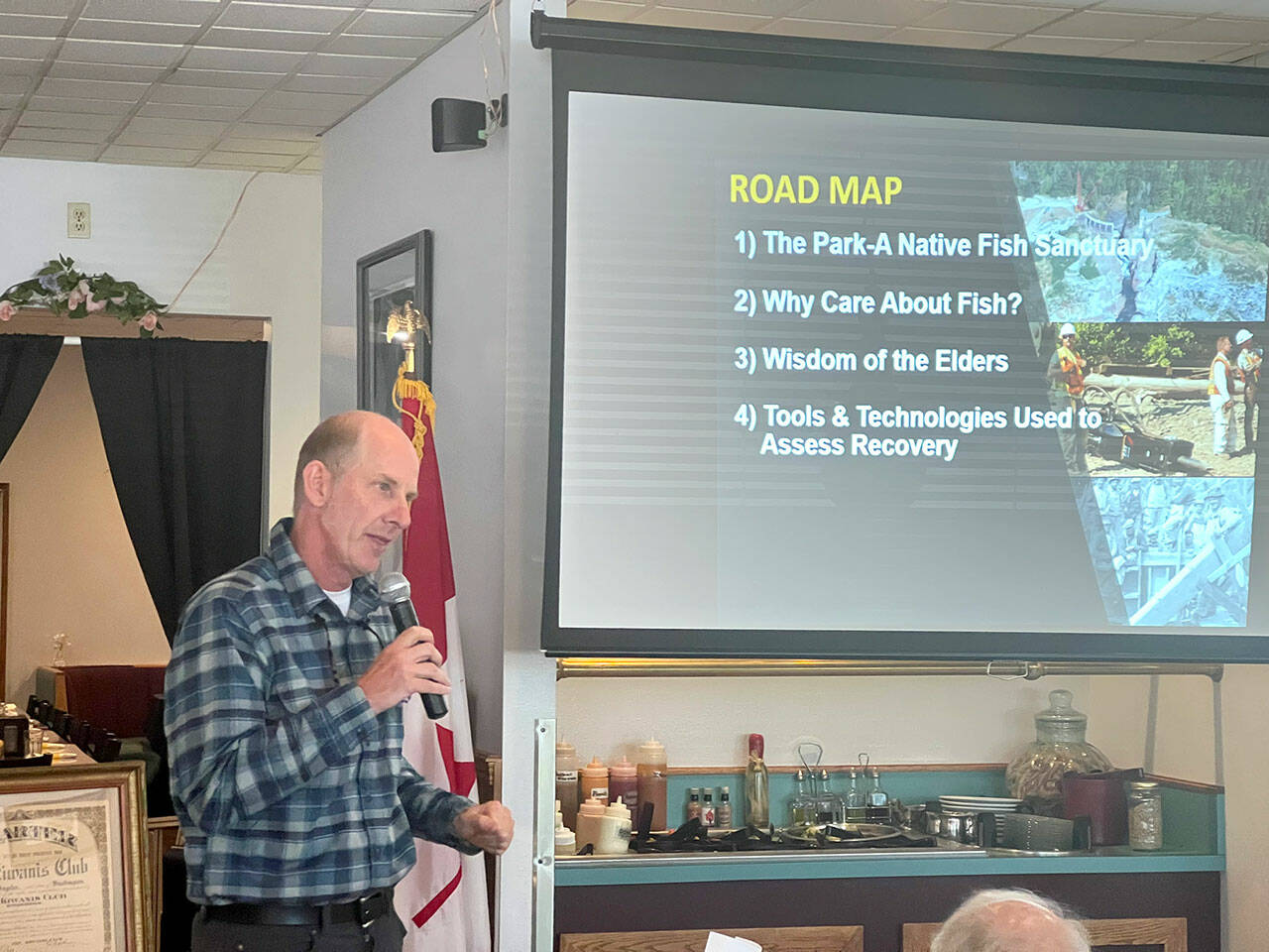 Sam Brenkman, chief fisheries biologist for Olympic National Park, speaks about fish restoration on the Elwha River following the removal of two dams during a meeting of the Kiwanis Club of Port Angeles at Joshuas Restaurant on Thursday. (Peter Segall/Peninsula Daily News)