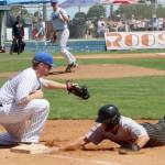 Port Angeles Lefties first baseman Owen Alsup takes the pickoff throw from his pitcher Reid Rasmussen to try to get Bend Elks runner Hunter Komine on Sunday at Civic Field in Port Angeles. Alsup later hit a home run. (Dave Logan/for Peninsula Daily News)