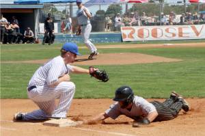 Port Angeles Lefties first baseman Owen Alsup takes the pickoff throw from his pitcher Reid Rasmussen to try to get Bend Elks runner Hunter Komine on Sunday at Civic Field in Port Angeles. Alsup later hit a home run. (Dave Logan/for Peninsula Daily News)